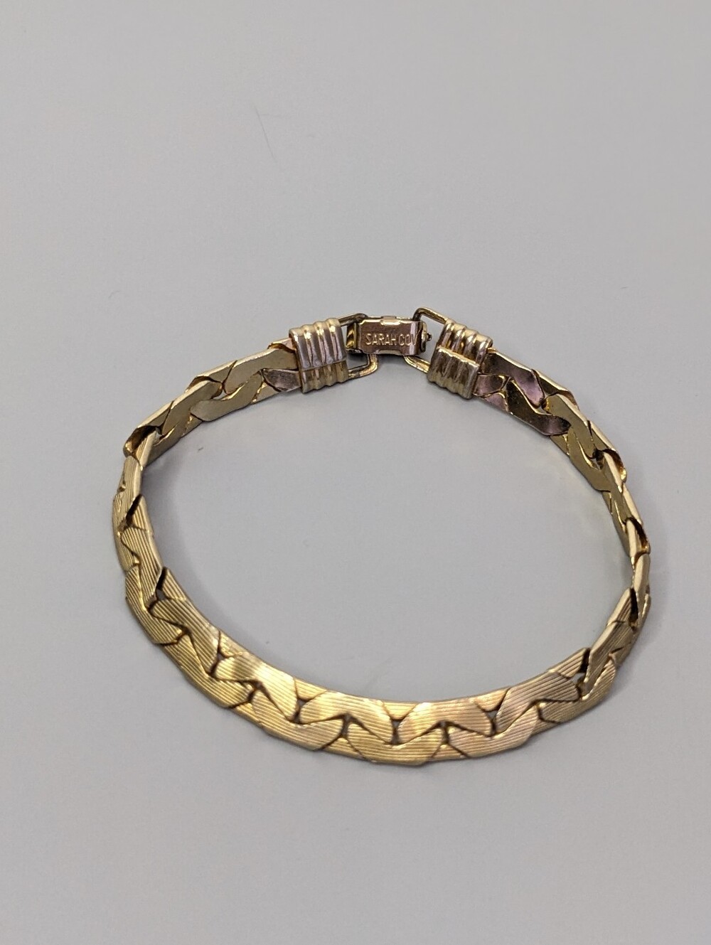 1950s Sarah Coventry Gold Tone Woven Link Bracelet With Classic Fold Over Clasp
